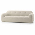Canapé trois places en tissu bouclé beige 230cm